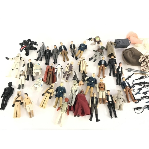 283 - A Collection of Vintage Star Wars Figures and Guns.