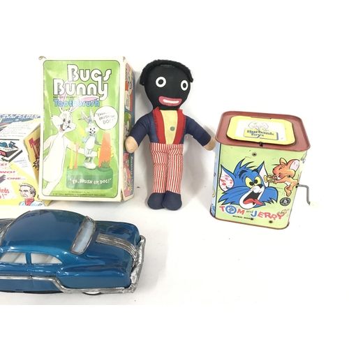 286 - Assorted collection of vintage toys including tin plate music box and bugs bunny toothbrush.