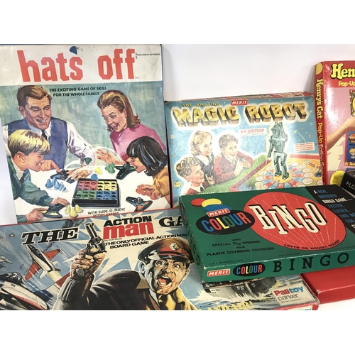 310 - Collection of various board games including magic robot and the action man game.