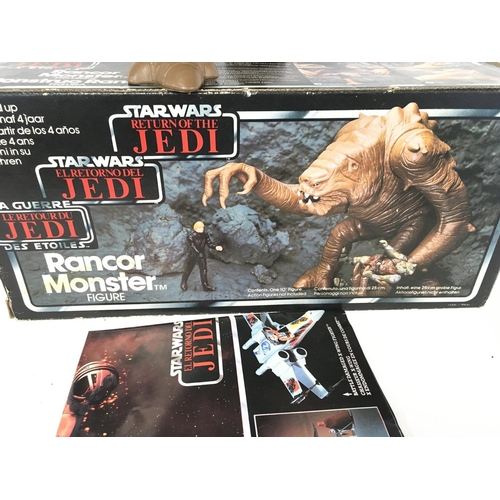 319 - A Boxed Star Wars Return Of The Jedi Tri-Logo Rancor Monster.