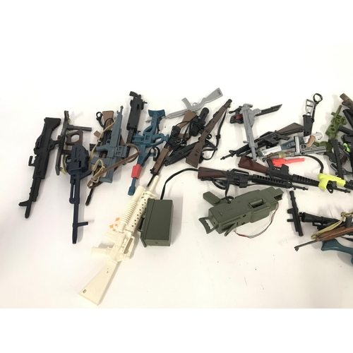 322 - Large collection of various guns including accessories including those for action man.