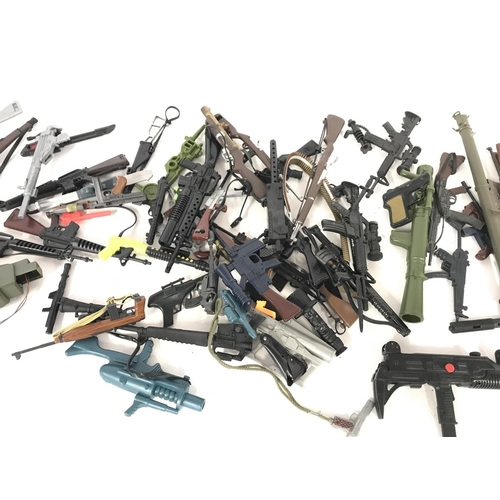 322 - Large collection of various guns including accessories including those for action man.