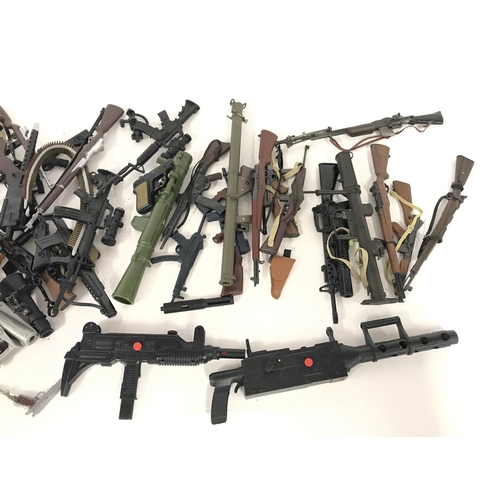 322 - Large collection of various guns including accessories including those for action man.