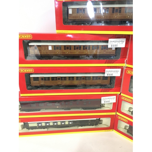 339 - A Collection of Boxed Hornby 00 Gauge Coaches and a Freight Rolling Stock Set.