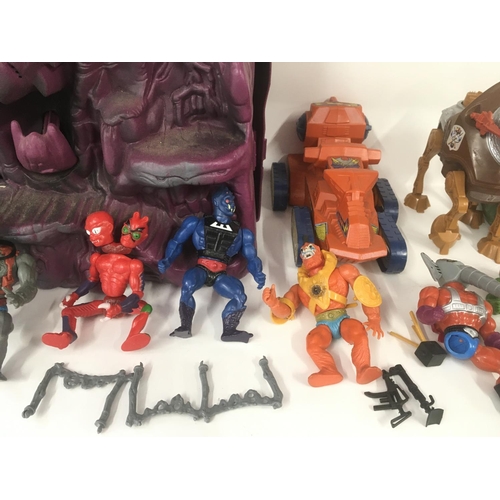 402 - A box of masters universes and he-man including figures and vehicles.