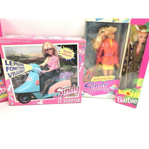 41 - A Box Containing a Collection of Boxed Sindys. Barbies and a Talking Tina.