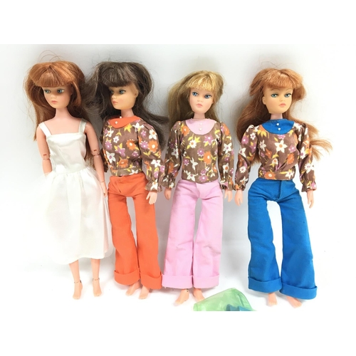 43 - A Collection of 4 Action Girl Dolls and Clothing.