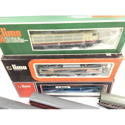 47 - A Collection of 00 Gauge Locos and Coaches (Some Boxed) including Lima and Tri-Ang.