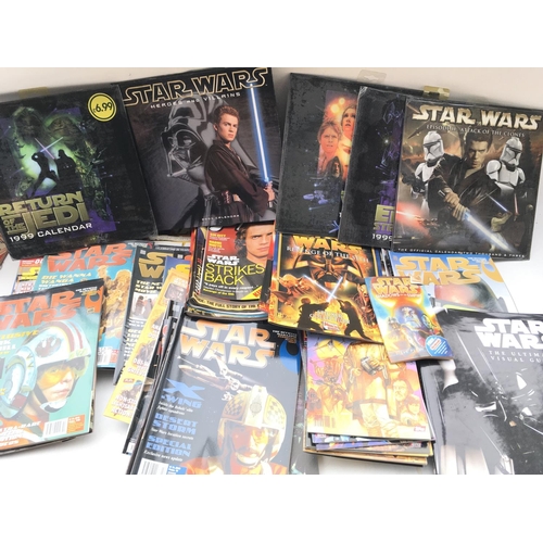 699 - A Box Containing A Collection of Star Wars Insider Magazines.calendars etc.