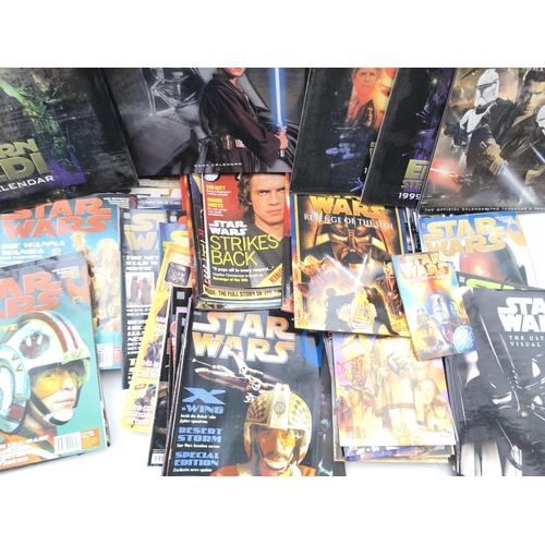 699 - A Box Containing A Collection of Star Wars Insider Magazines.calendars etc.