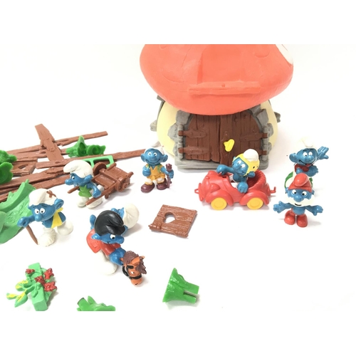 75 - A Collection of Vintage Smurf Figures and a House.