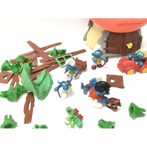 75 - A Collection of Vintage Smurf Figures and a House.