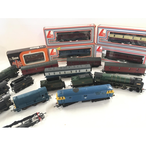 766 - A Box Containing a Collection of 5 00 Gauge Locomotives and Boxed Carriages.