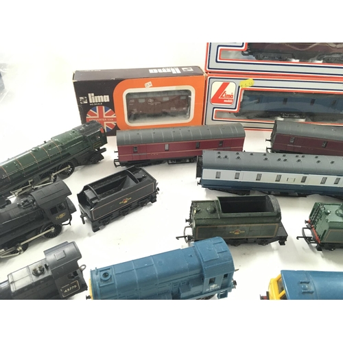 766 - A Box Containing a Collection of 5 00 Gauge Locomotives and Boxed Carriages.