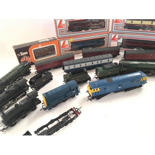 766 - A Box Containing a Collection of 5 00 Gauge Locomotives and Boxed Carriages.