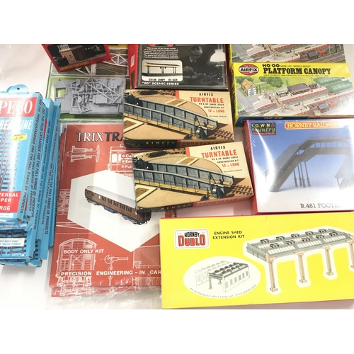 769 - A Collection of 00 Gauge boxed Track. Coach Kits. Platforms. Etc.