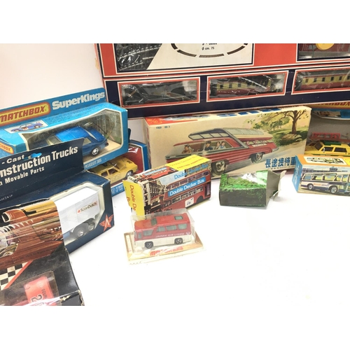 84 - A Box Containing a Collection of Various boxed Die-cast including Matchbox Super Kings. A Lima Train... 