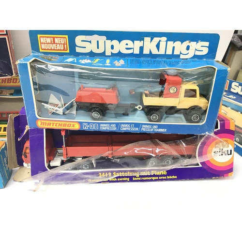 84 - A Box Containing a Collection of Various boxed Die-cast including Matchbox Super Kings. A Lima Train... 