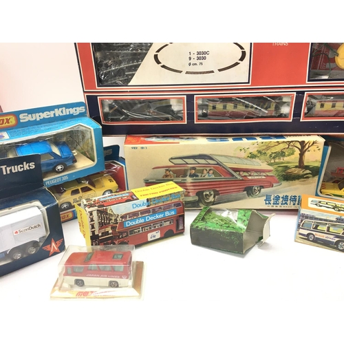 84 - A Box Containing a Collection of Various boxed Die-cast including Matchbox Super Kings. A Lima Train... 