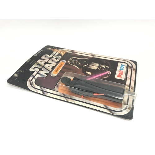 9 - A Vintage Star Wars Palitoy 1977 Carded Darth Vader. One of the first 12 Figures released.in Punched