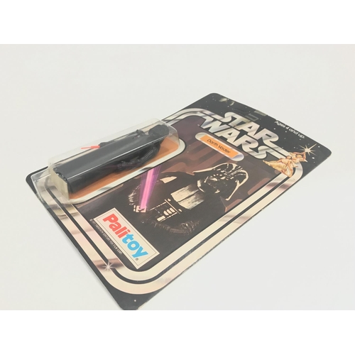 9 - A Vintage Star Wars Palitoy 1977 Carded Darth Vader. One of the first 12 Figures released.in Punched