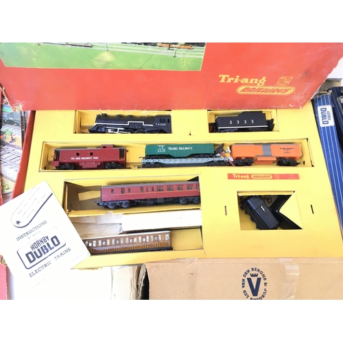 876 - A Boxed Tri-Ang Electric Model Railway with Track and Model Magazines.