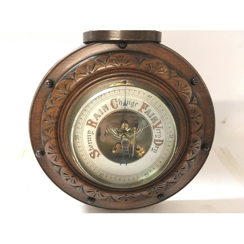 1728 - Antique barometer-thermometer in carved wooden vase. 40cm approx.