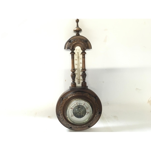 1728 - Antique barometer-thermometer in carved wooden vase. 40cm approx.