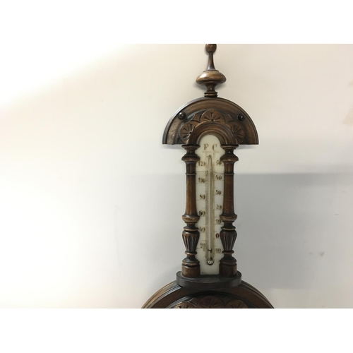 1728 - Antique barometer-thermometer in carved wooden vase. 40cm approx.