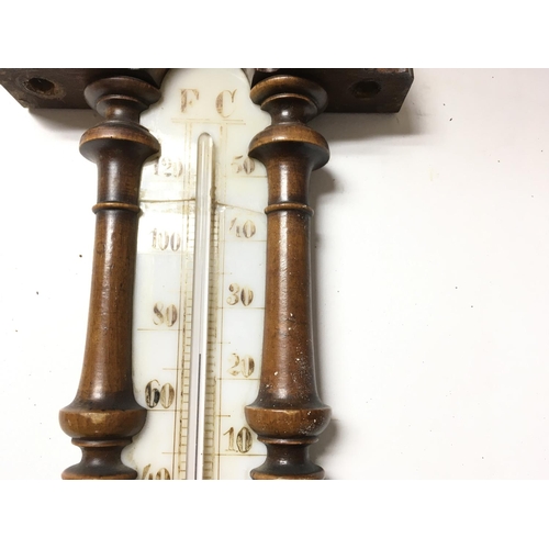 1728 - Antique barometer-thermometer in carved wooden vase. 40cm approx.