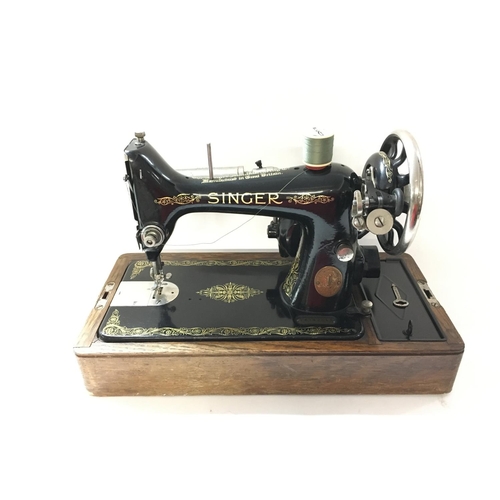 1729 - Singer manufacturing electric sewing machine c1921. With box and key.