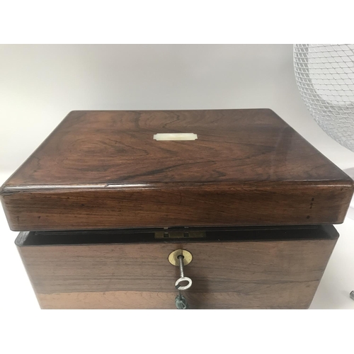 711 - A Victorian rosewood vanity box enclosing a well fitted interior.