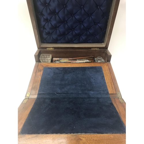 712 - A Victorian walnut sewing/ writing box inlaid with mother of Pearl.