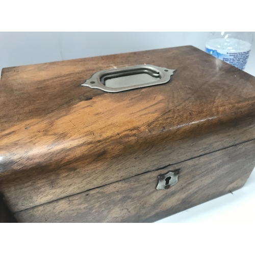 714 - A rosewood vanity case and a walnut case vanity case .