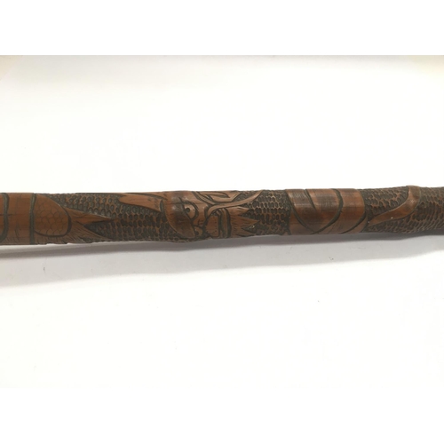 750 - A walking stick carved with a dragon to the shaft a/f.