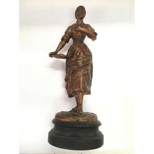 775 - A heavy spelter Victorian figure of a lady flower seller raised on a circular base, approx height 43... 