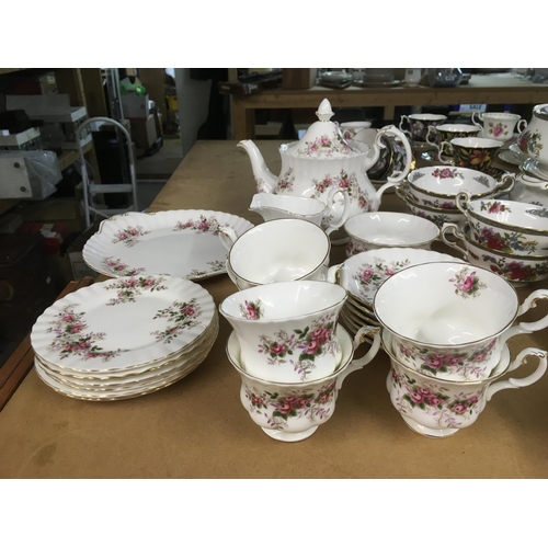 805 - A Royal Albert tea set in Lavender Rose pattern, teapot of second quality.