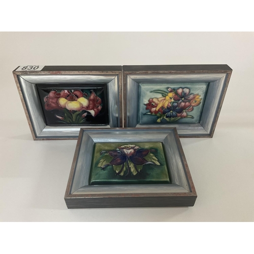 830 - 3 Moorcroft pottery framed pot lids with Spring, Freesia and Columbine patterns, 16 x 13cm with fram... 