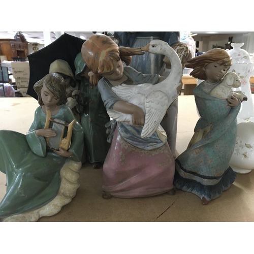 860 - A collection of 21 Lladro figures including cherubs and children ducks doves and geese. No damage or... 