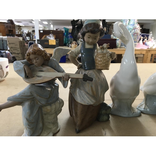 860 - A collection of 21 Lladro figures including cherubs and children ducks doves and geese. No damage or... 