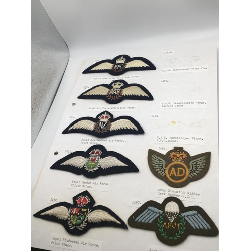 2019 - An album containing military and RAF badges some cloth badges including commando SAS Parachute regim... 