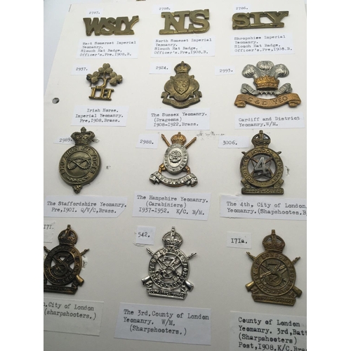 2030 - An album containing military cap badges mounted on three cards. Mainly Yeomanary.