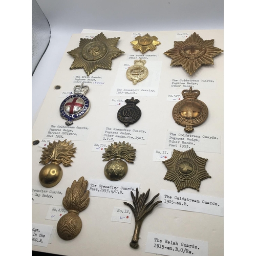 2036 - A collection of military cap badges predominantly Dragoon's Guards and others mounted on five cards.