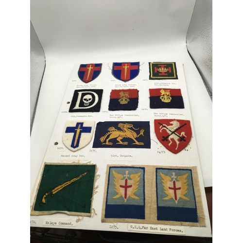 2038 - An album containing cloth embroidered Military Divisional sign badges mainly II world war.