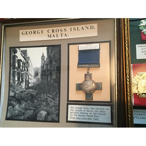 2046 - A London Blitz display a retrospective framed George cross display under glass and a Douglas Barder ... 