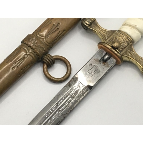 2077 - A German Third Reich Kriegsmarine officers presentation dagger with makers mark the wire missing fro... 