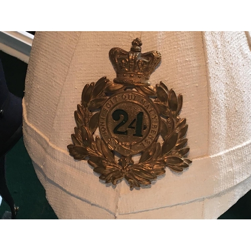 2098 - A Vintage Metropolitan Police helmet a brass fireman helmet a Navy officers hat and one other with a... 