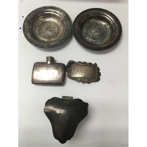 783 - A small collection of silver including dishes inset with coins , trinket box wine label and flask.