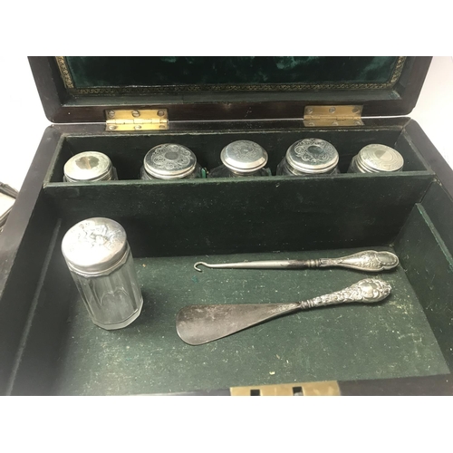 752 - A Victorian rosewood vanity box enclosing a well fitted interior.