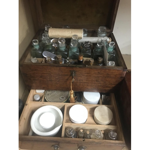 754 - A Georgian oak apothecary box various bottles one other apothecary box and microscope.
